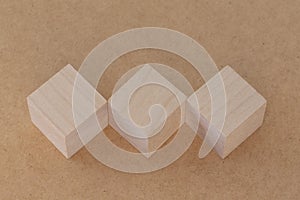 Wooden toy cubes on a light background. Business and design concept, Symbol of leadership