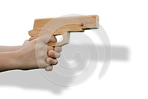 Wooden toy gun in child's hand