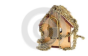 Wooden toy house in chains