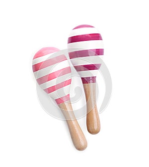 Wooden toy maracas on white background, top view