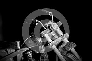 Wooden toy motorcycle on a dark background