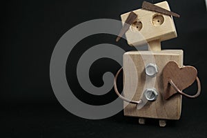 Wooden toy robot holding a heart