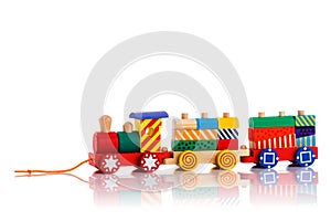 Wooden toy train with colorful blocks isolated over white background