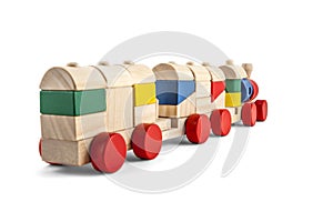 Wooden toy train with colorful blocs isolated over white with cl