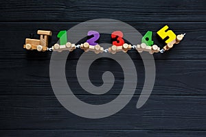 Wooden toy train with numbers for children, toys for creativity development. Children`s school concept. Educational games