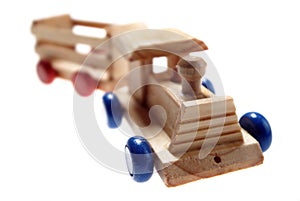 Wooden toy train on white background and selective focus