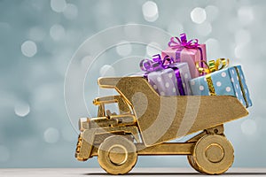 Toy car with gift boxes in festive wrapper.