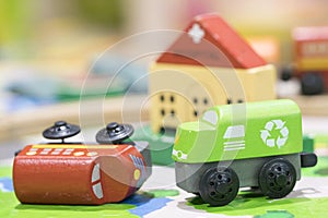 Wooden toy two trains on road with hospital