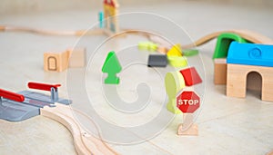 Wooden toys on the floor of a room