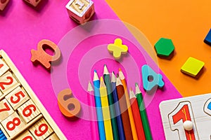Wooden toys, pencils, blocks with numbers. Preschool, elementary school education. Development games for kids. Educational daycare