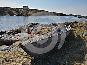 Wooden traditional Norwegian boat on the fjord coast