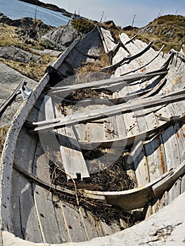 Wooden traditional Norwegian boat on the fjord coast