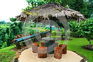 Wooden traditional Polynesian shelter with palm thatch roof, Sopoaga Waterfall resort in Samoa, Upolu Island