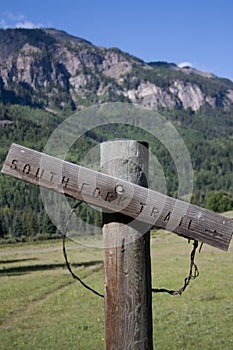Wooden Trail Sign in Mountains