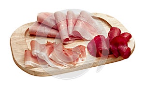 wooden tray on white with three types of salami