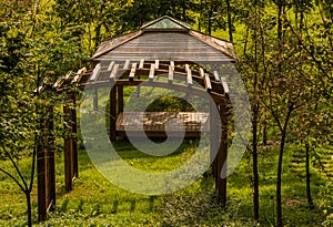 Wooden trellis in front of covered picnic pavilion