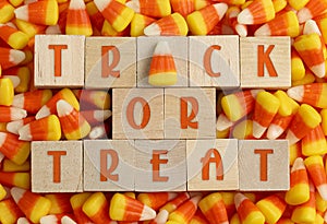 Wooden Trick or Treat sign with a Background of Classic Candy Corn