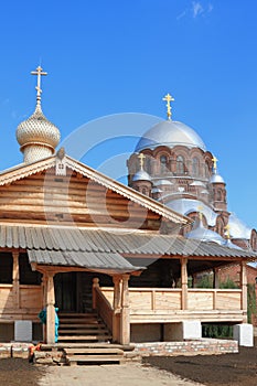 Wooden Trinity Church and dome of stone cathedral. Island Sviyazhsk, Tatarstan