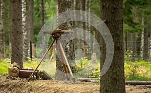 Wooden tripod and a table for cards of wartime. Cartographer equipment