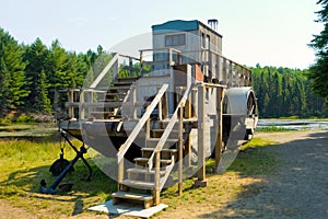 A wooden tug used in the logging industry in the past