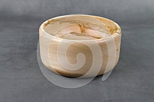 A wooden turned bowl with natural structures
