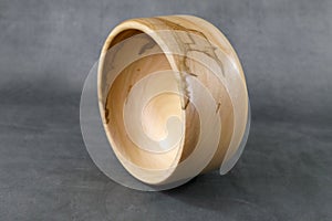 A wooden turned bowl with natural structures