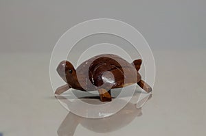 A wooden turtle on white background