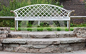 Wooden two seater bench at central park wallasey wirral july 2019