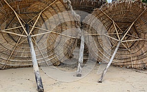 Wooden umbrellas on the beach in Khanh Hoa, Vietnam