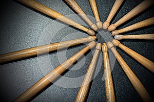 Wooden used drumsticks on a dark background - Percussion instrument 1