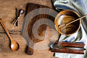 Wooden utensil in kitchen on old wooden background