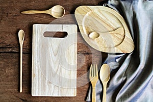 Wooden utensil in kitchen on old wooden background