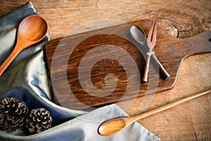 Wooden utensil in kitchen on old wooden background