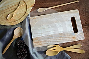 Wooden utensil in kitchen on old wooden background