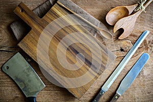 Wooden utensil in kitchen on old wooden background