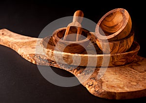 Wooden utensils. Cutting board, bowls and scoop