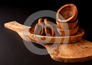 Wooden utensils. Cutting board, bowls and scoop