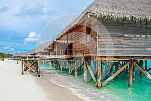 Wooden villas over water of the Indian Ocean