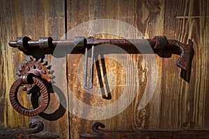 Wooden vintage door with latch rusty lock