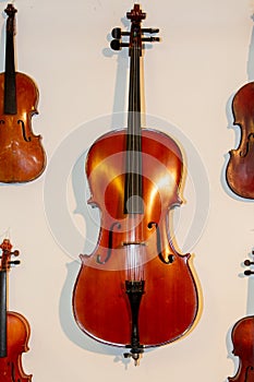 Wooden violins hanging on the wall