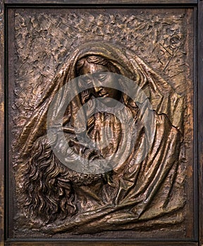 Wooden Virgin and Jesus bas relief in the Parroquia de Santa MarÃ­a la Mayor Saint Mary Major Parish in Ronda. Malaga, Andalusia.