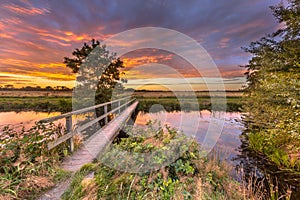 Wooden walking bridge at sunset