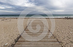 Wooden walkway on the beach of Bol Nou