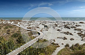 Wooden walkway by the beach at Tauparikaka Marine Reserve, , New Zealand