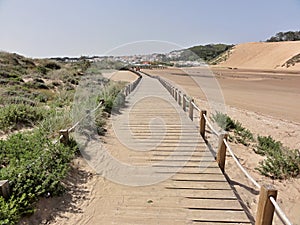 Wooden walkway in the dunes of Salir photo