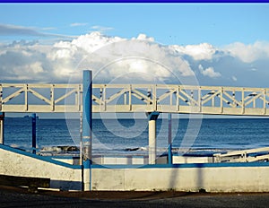 wooden walkway facing the blue sea