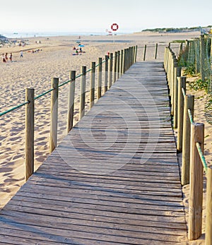 Wooden walkway, people, beach, church