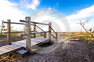 Wooden walkway on sand dune to beach.