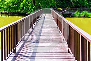 Wooden walkway in Sri Nakhon Khuean Khan Park and Botanical Garden