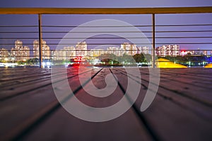 Wooden walkways and night views of the city